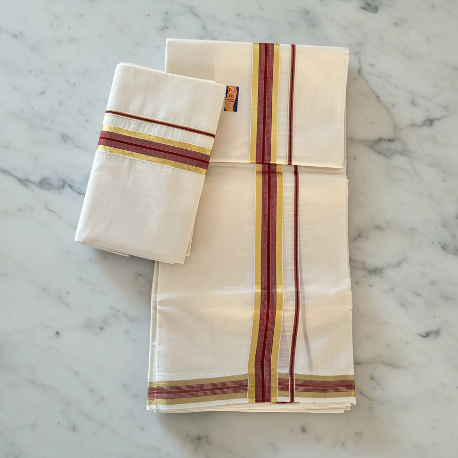 Two white cloths with red and yellow stripes on a wooden surface
