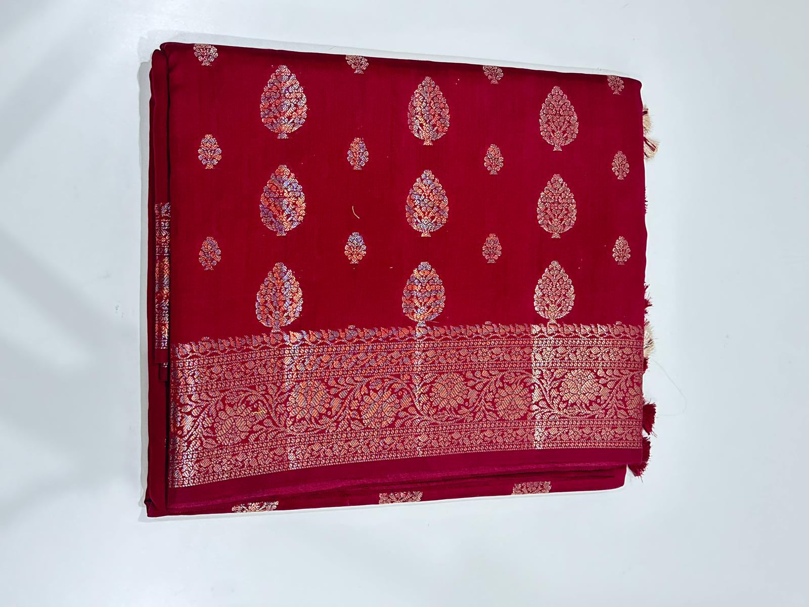Maroon Fancy Chiniya silk saree with gold zari motifs and tassels