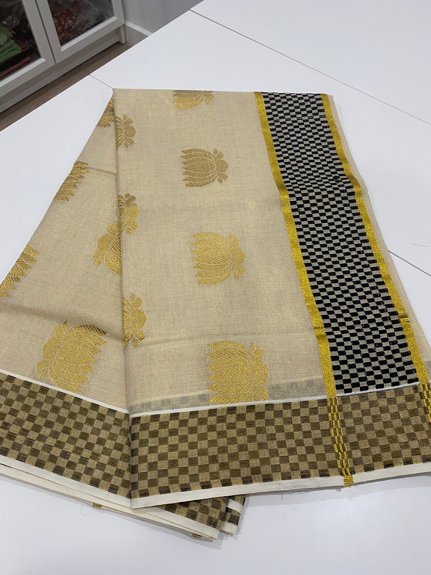 Premium Lotus Tissue Onam Saree with Black & Gold Border