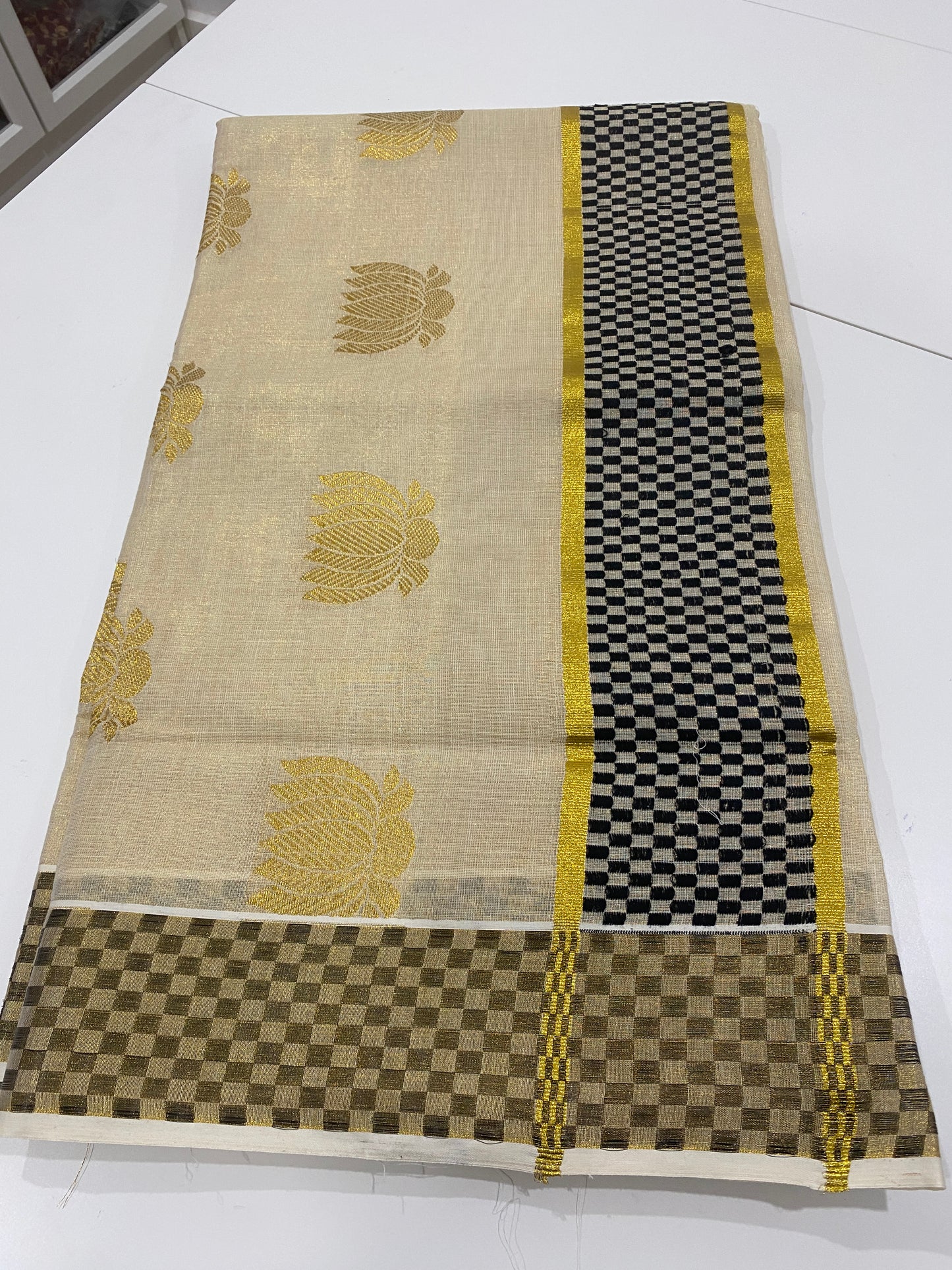 Premium Lotus Tissue Onam Saree with Black & Gold Border