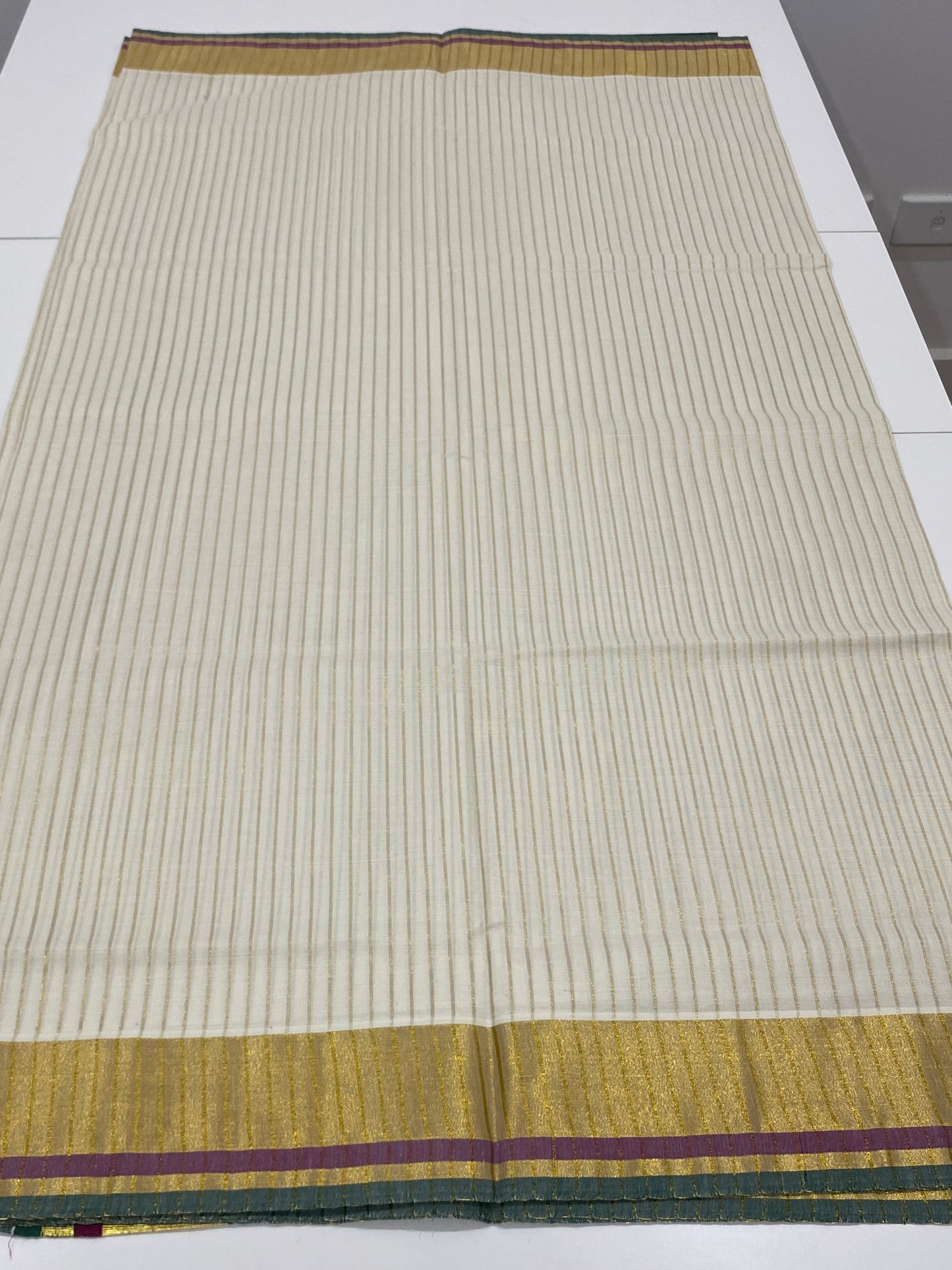 Onam Cotton Saree in Off-White with Golden Stripes and Green Wine Pallu Lines
