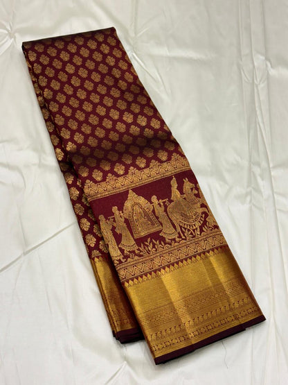 Traditional maroon Kanchipuram saree featuring wedding procession design
