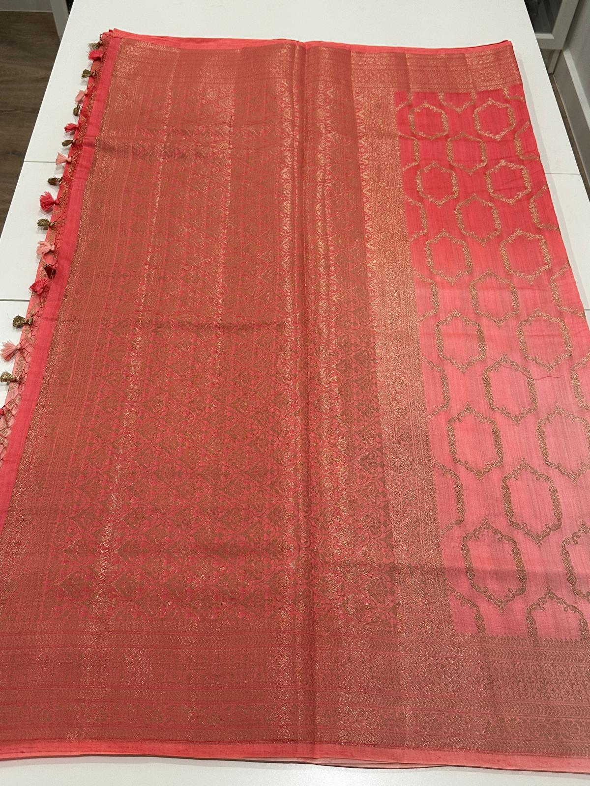 Fancy Chiniya silk saree folded with matching richly woven blouse piece