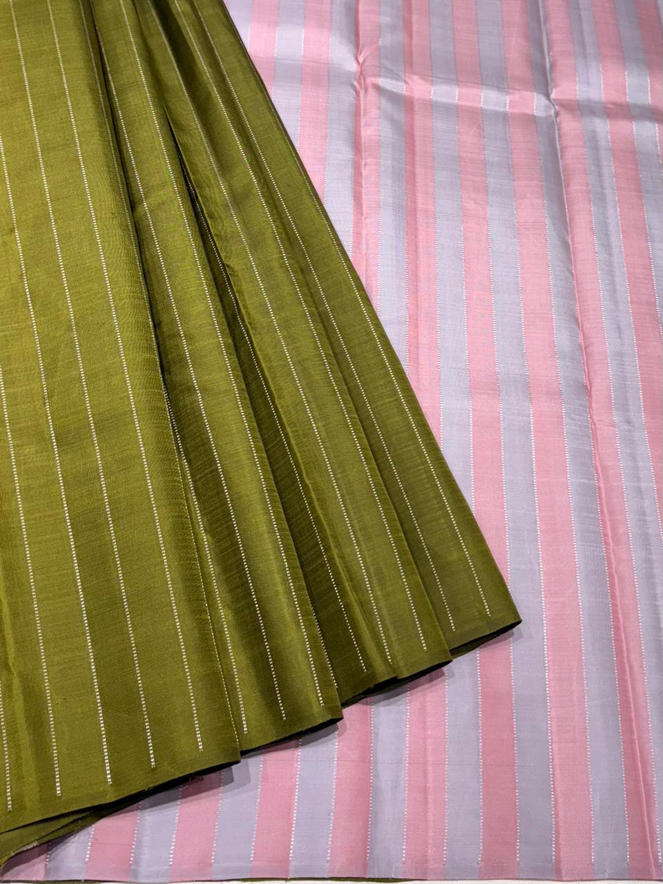 Green Kanchipuram silk saree with silver vertical stripes and pink lavender pallu – full view