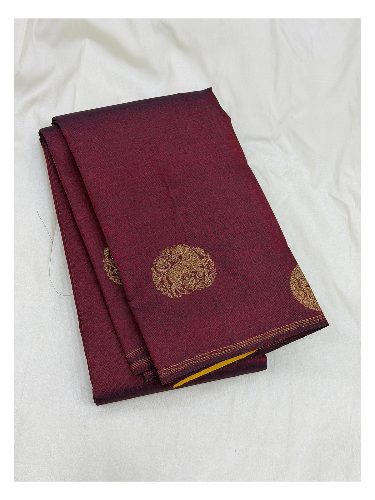 Handwoven Kanchipuram silk saree in deep wine with gold-toned elephant-style motifs