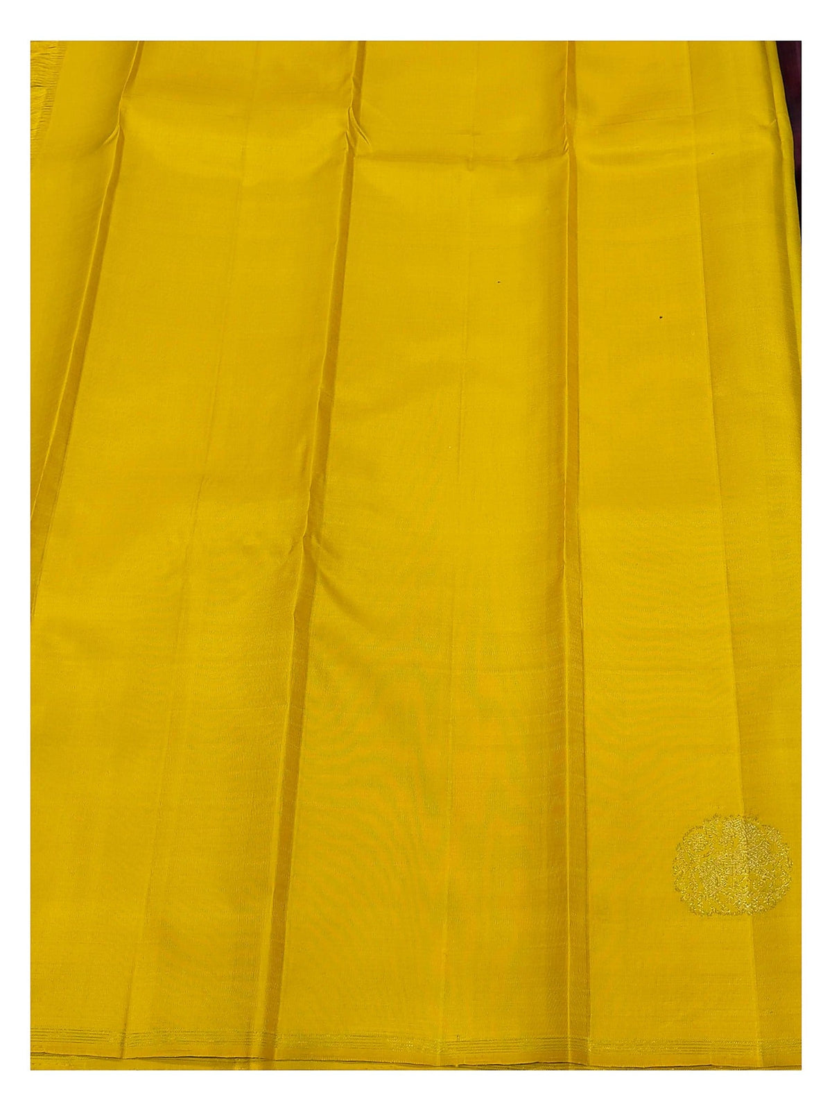 Contrast yellow section of the handwoven Kanchipuram silk saree with gold-toned woven motif