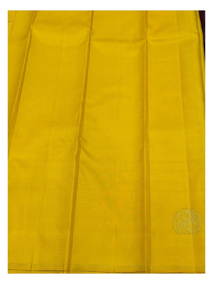 Contrast yellow section of the handwoven Kanchipuram silk saree with gold-toned woven motif