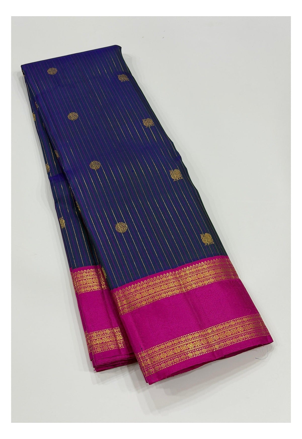 Deep blue Kanchipuram silk saree with pink contrast border and zari stripes