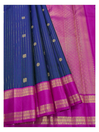 Deep blue body with woven motifs and pink pallu detail on Kanchipuram silk saree