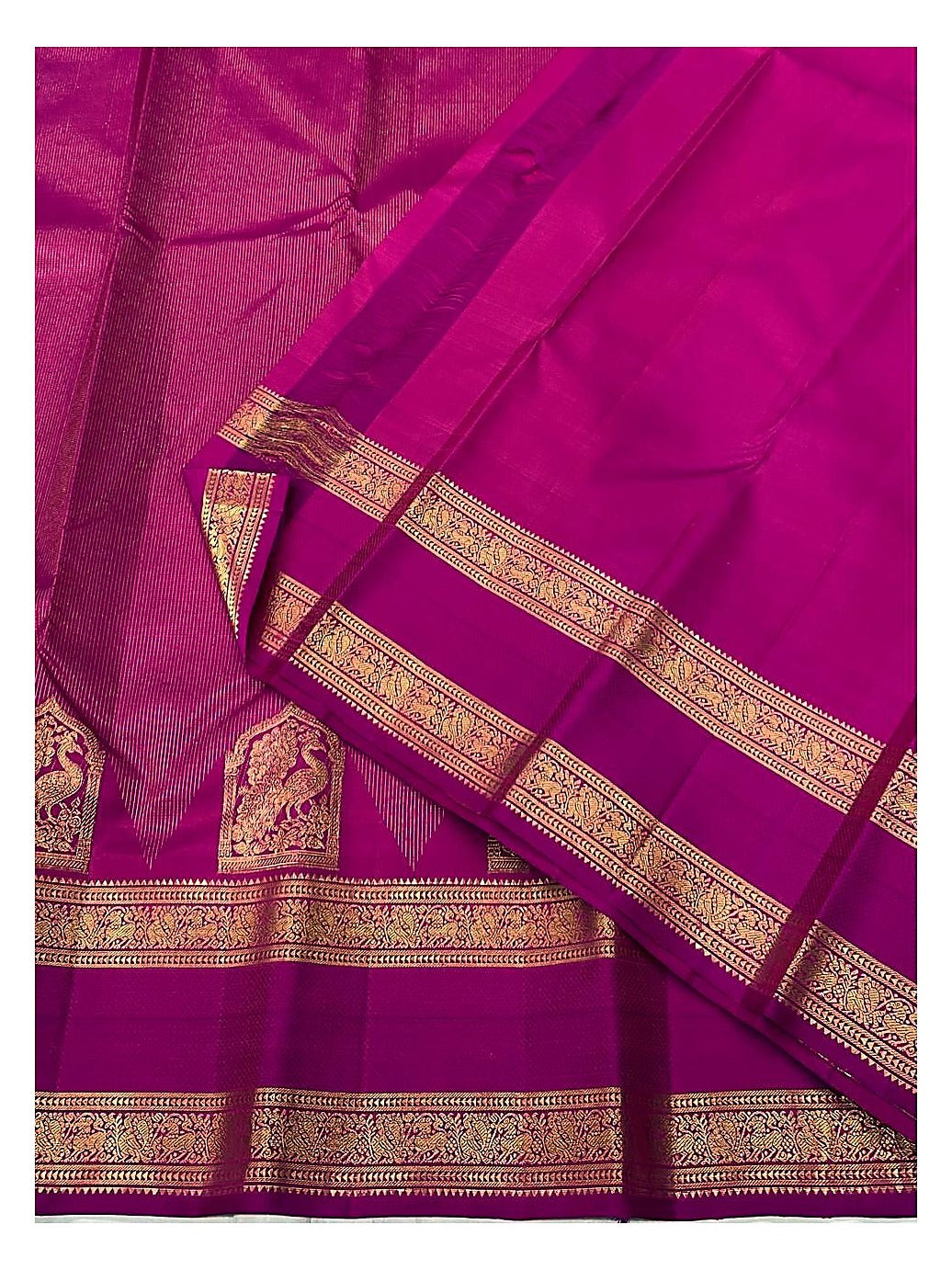Handwoven Kanchipuram Silk Saree in Magenta Pink with Gold Zari Peacock Border