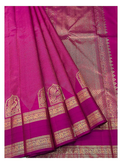 Handwoven Kanchipuram Silk Saree in Magenta Pink with Gold Zari Peacock Border