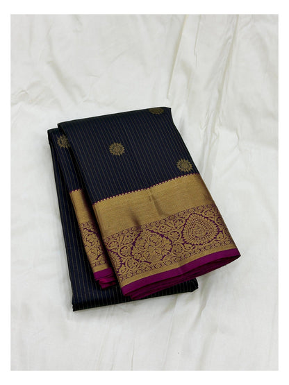 Handwoven Kanchipuram Silk Saree in Navy Blue with Gold Buttas and Magenta Contrast Pallu front view