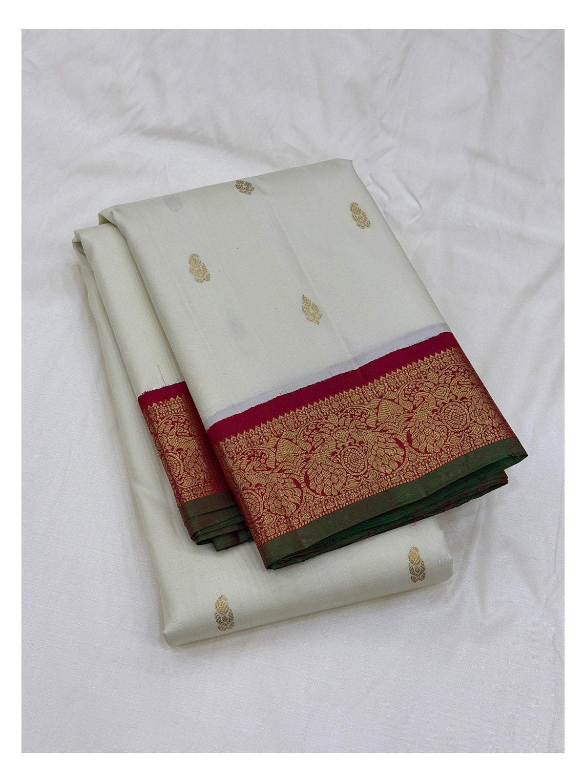 Handwoven Kanchipuram Silk Saree in Off-White with Gold Buttas and Magenta Contrast Pallu front view