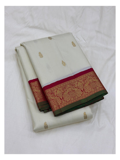 Handwoven Kanchipuram Silk Saree in Off-White with Gold Buttas and Magenta Contrast Pallu front view