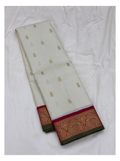 Handwoven Kanchipuram Silk Saree in Off-White with Gold Buttas and Magenta Contrast Pallu