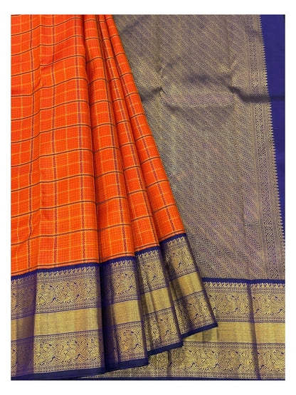 Handwoven Kanchipuram Silk Saree in Orange Checks with Royal Blue Peacock Border