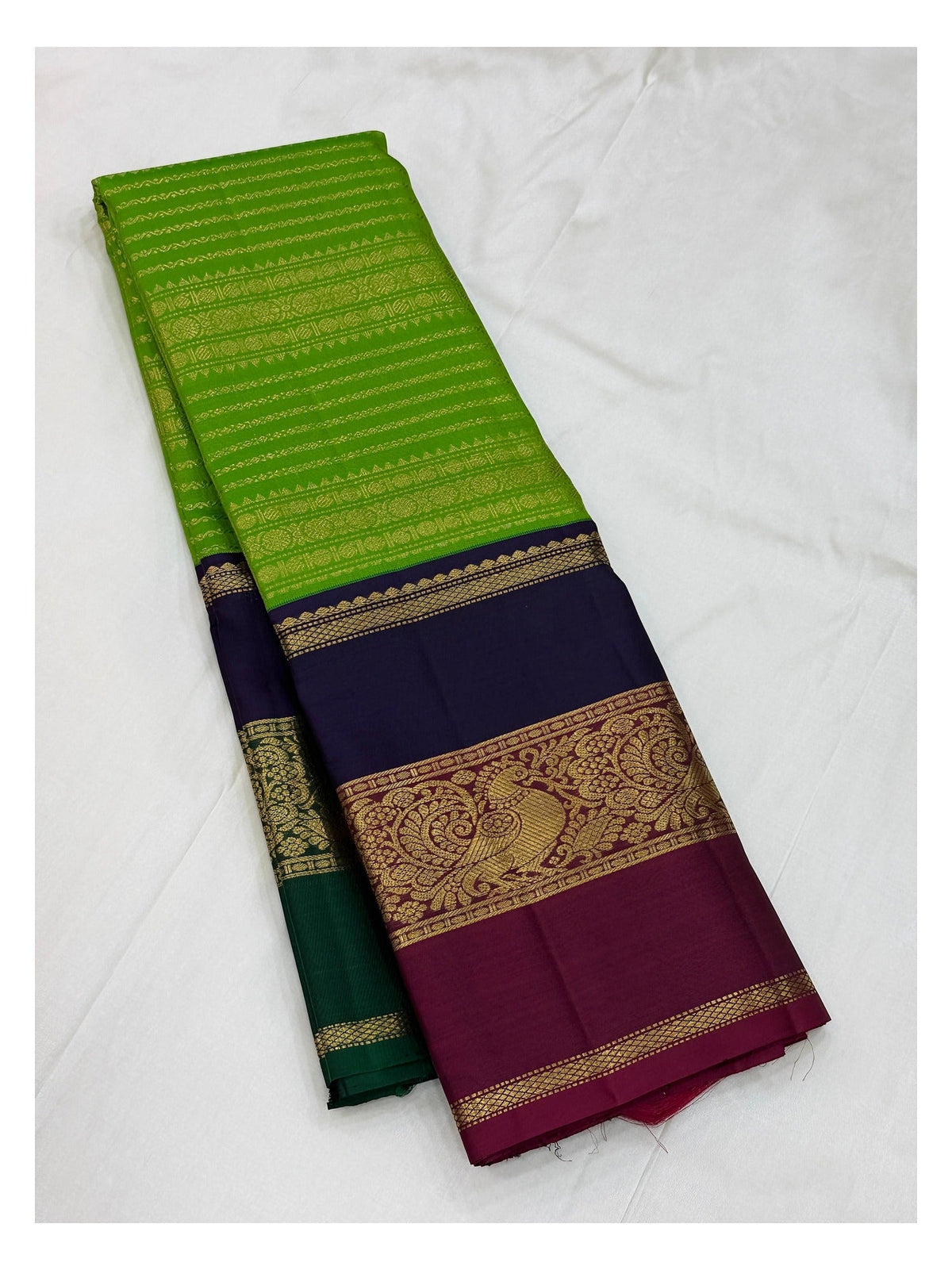 Handwoven Kanchipuram Silk Saree in Parrot Green with Navy Blue and Magenta Peacock Border