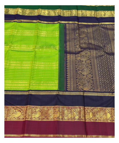 Handwoven Kanchipuram Silk Saree in Parrot Green with Navy Blue and Magenta Peacock Border