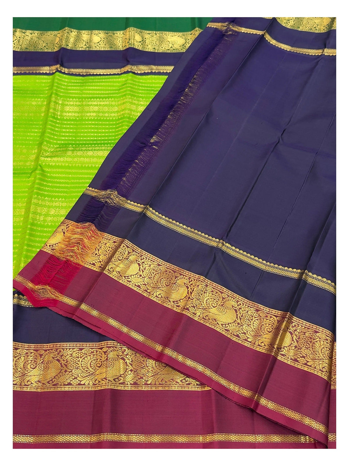 Handwoven Kanchipuram Silk Saree in Parrot Green with Navy Blue and Magenta Peacock Border