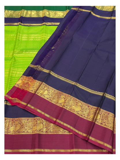Handwoven Kanchipuram Silk Saree in Parrot Green with Navy Blue and Magenta Peacock Border