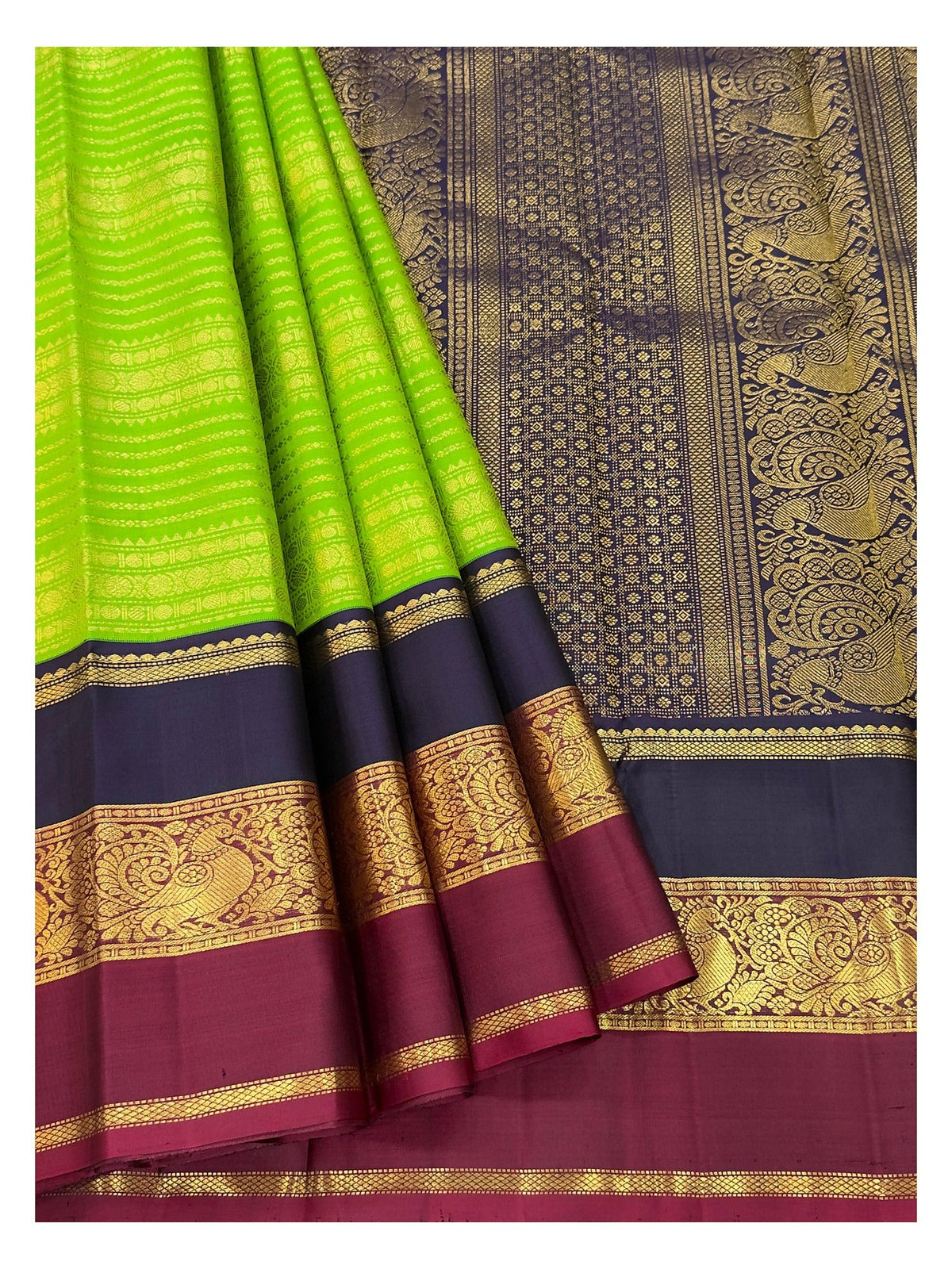 Handwoven Kanchipuram Silk Saree in Parrot Green with Navy Blue and Magenta Peacock Border