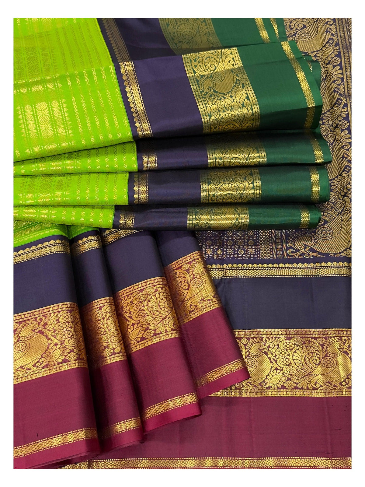 Handwoven Kanchipuram Silk Saree in Parrot Green with Navy Blue and Magenta Peacock Border
