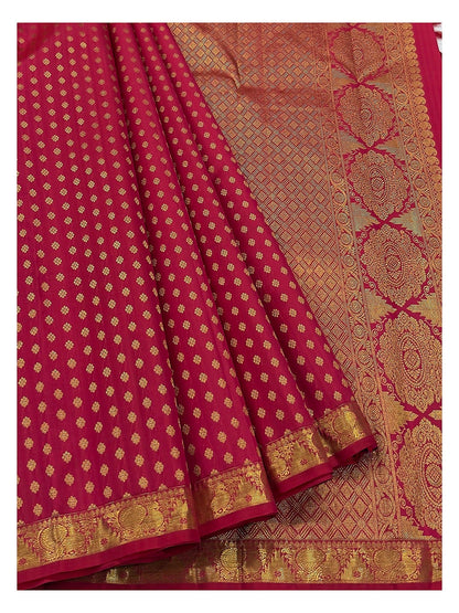 Rani pink handwoven silk saree with richly woven zari pallu and gold butta body