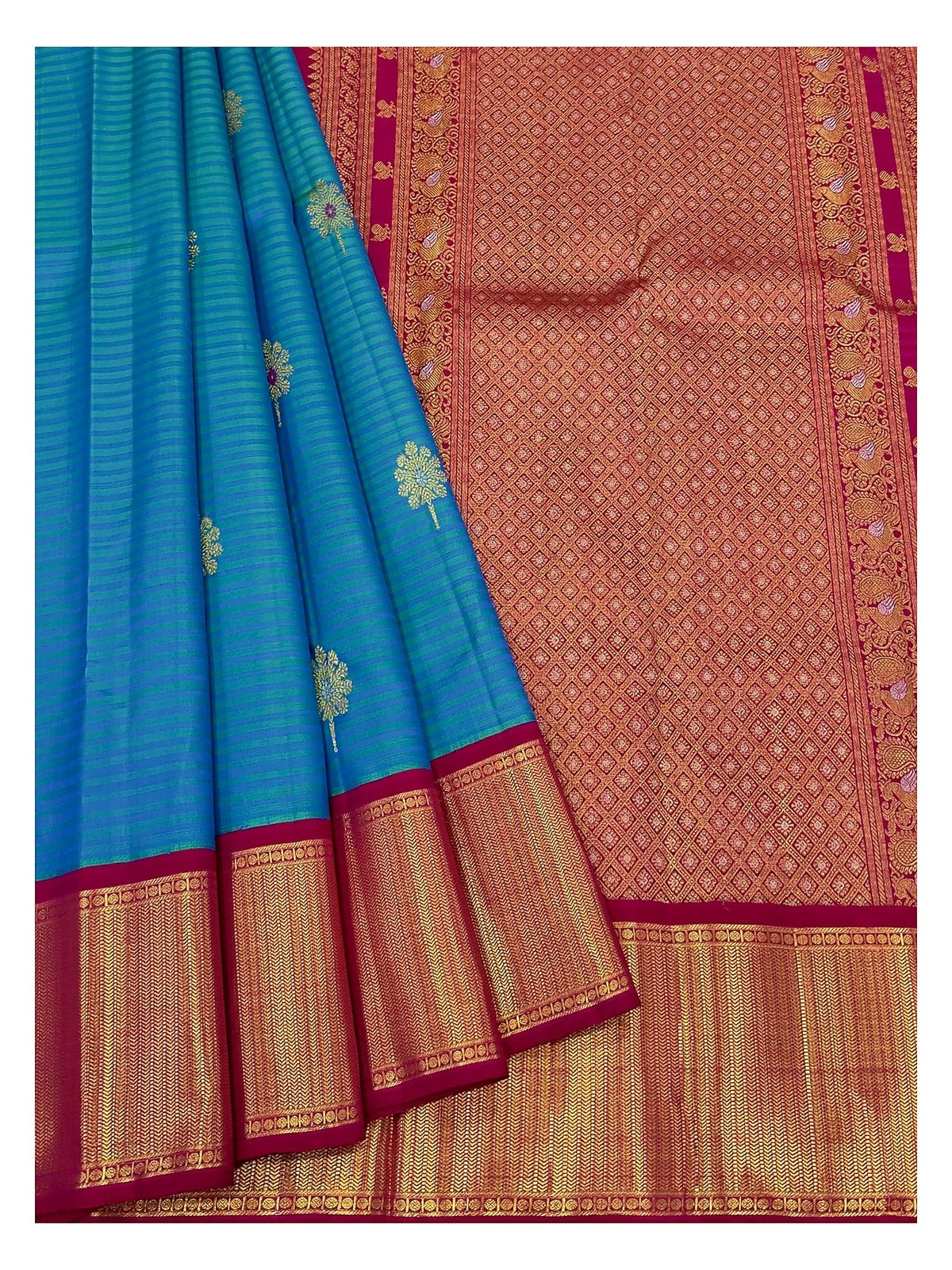 Teal blue saree drape with gold-toned motifs and richly woven contrast pallu