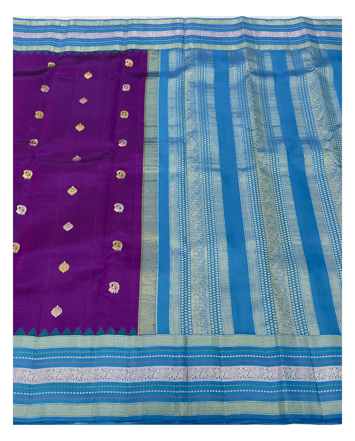 Full view of purple saree body with teal blue pallu and detailed woven border