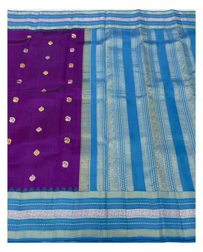 Full view of purple saree body with teal blue pallu and detailed woven border