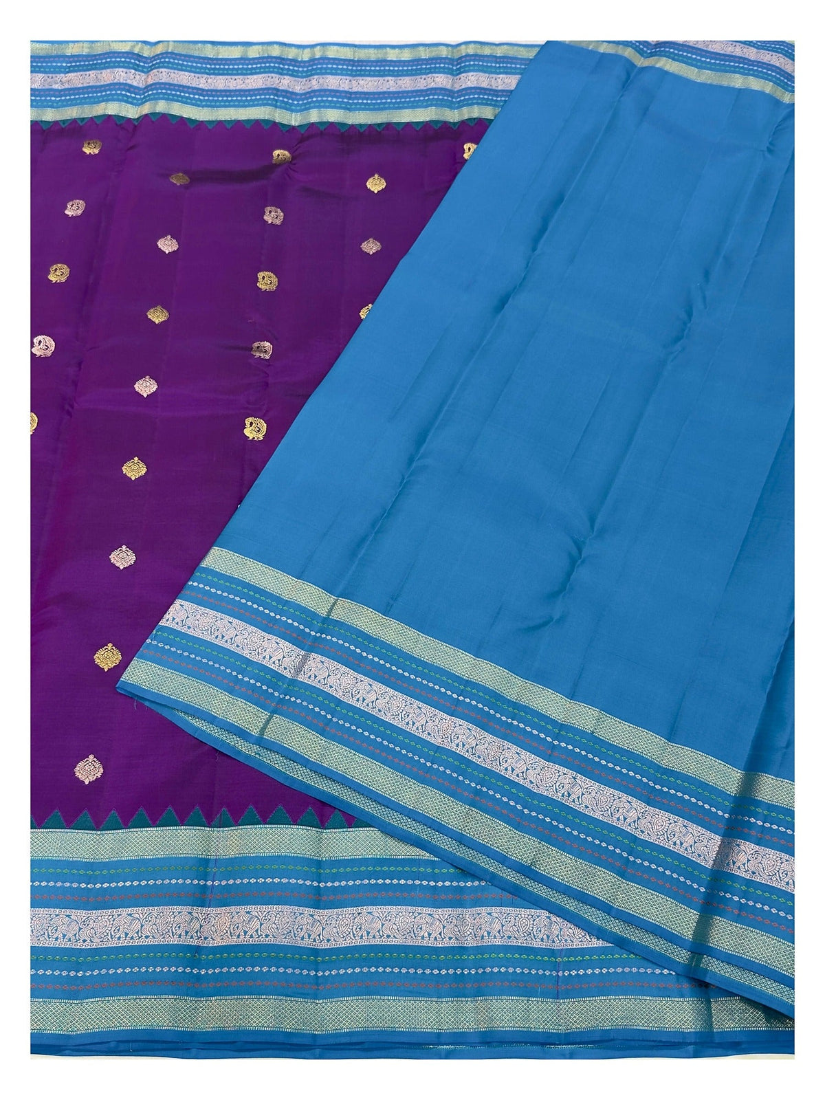 Contrast teal blue blouse piece shown with purple handwoven silk saree