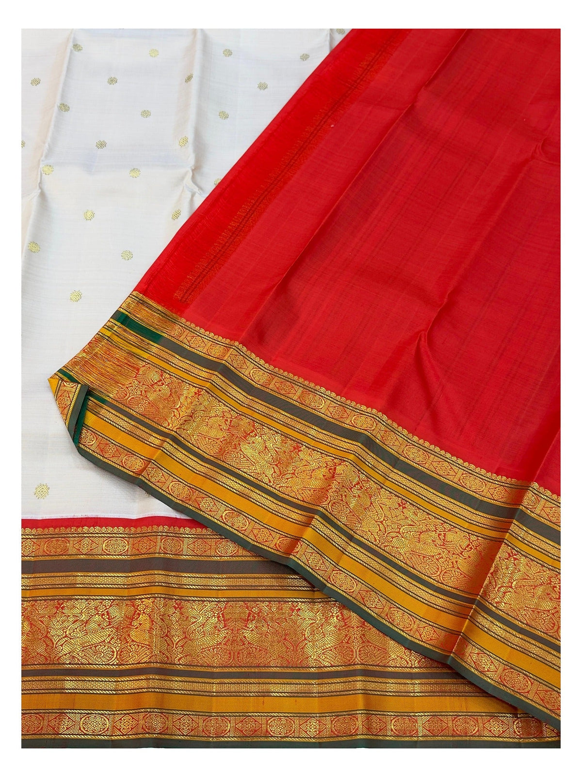 Detail view of the vermilion red pallu with antique gold woven motifs and border