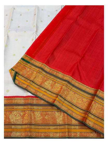 Detail view of the vermilion red pallu with antique gold woven motifs and border