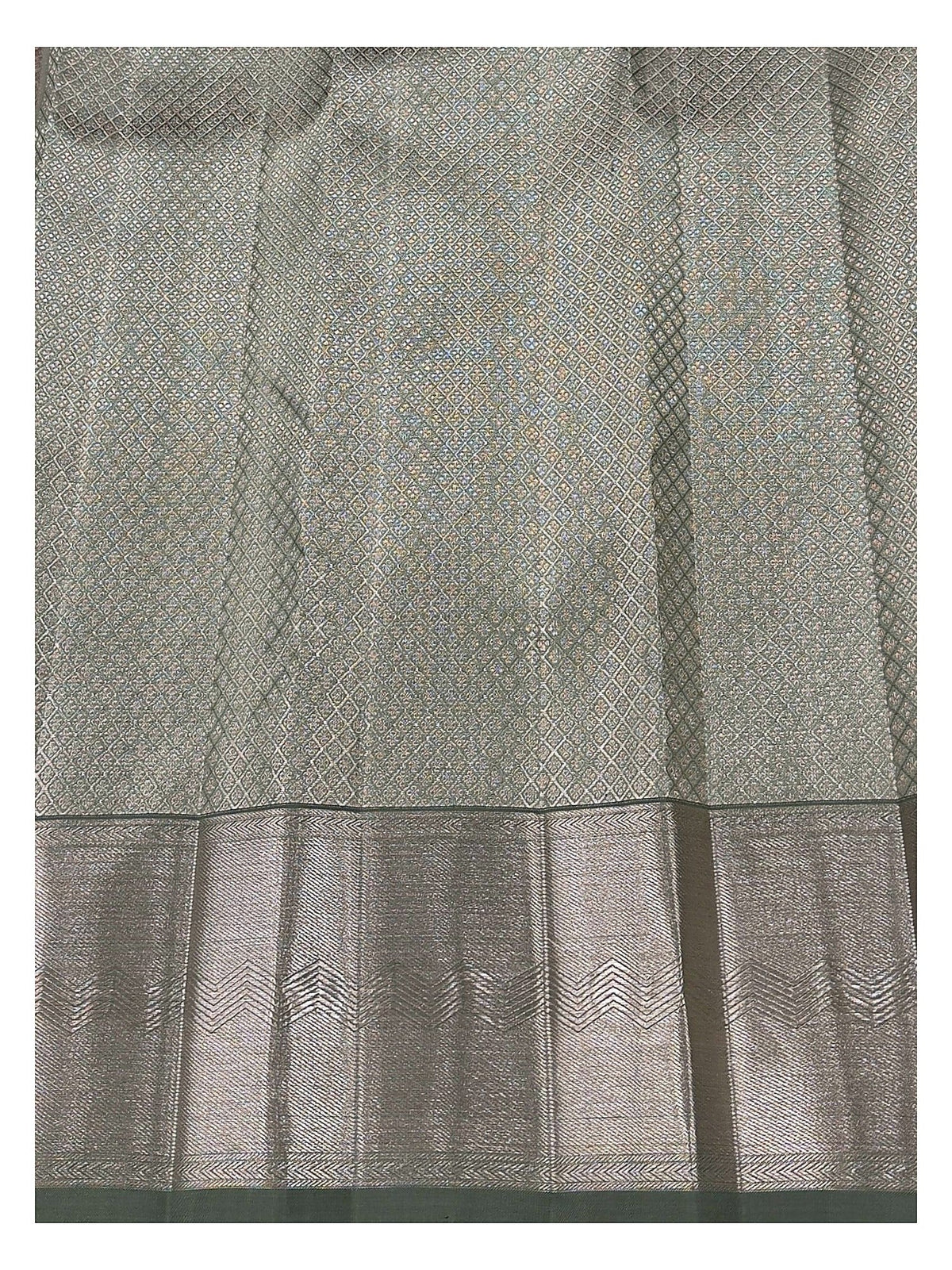 Close view of sage green saree body with fine geometric weave and broad antique gold zari border