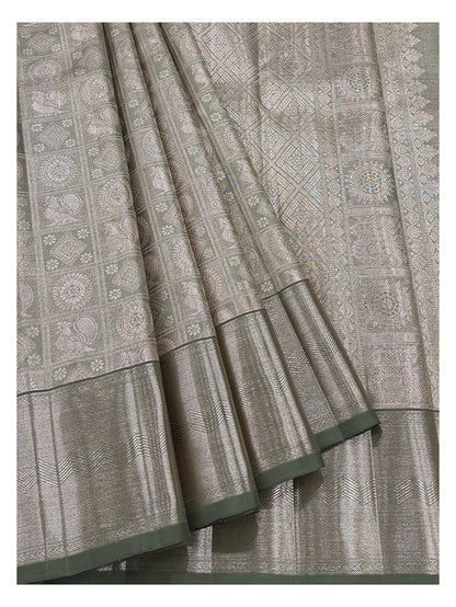 Detailed view of handwoven Kanchipuram silk saree showing motif panels and antique gold woven border