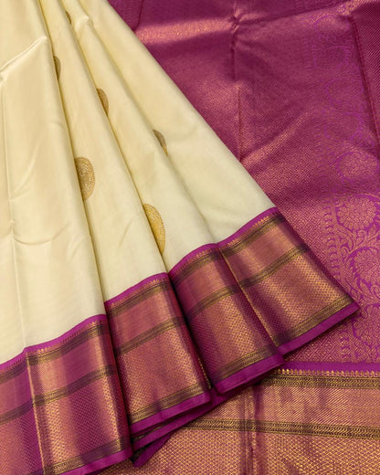 Handwoven ivory and magenta silk saree with rich gold zari work