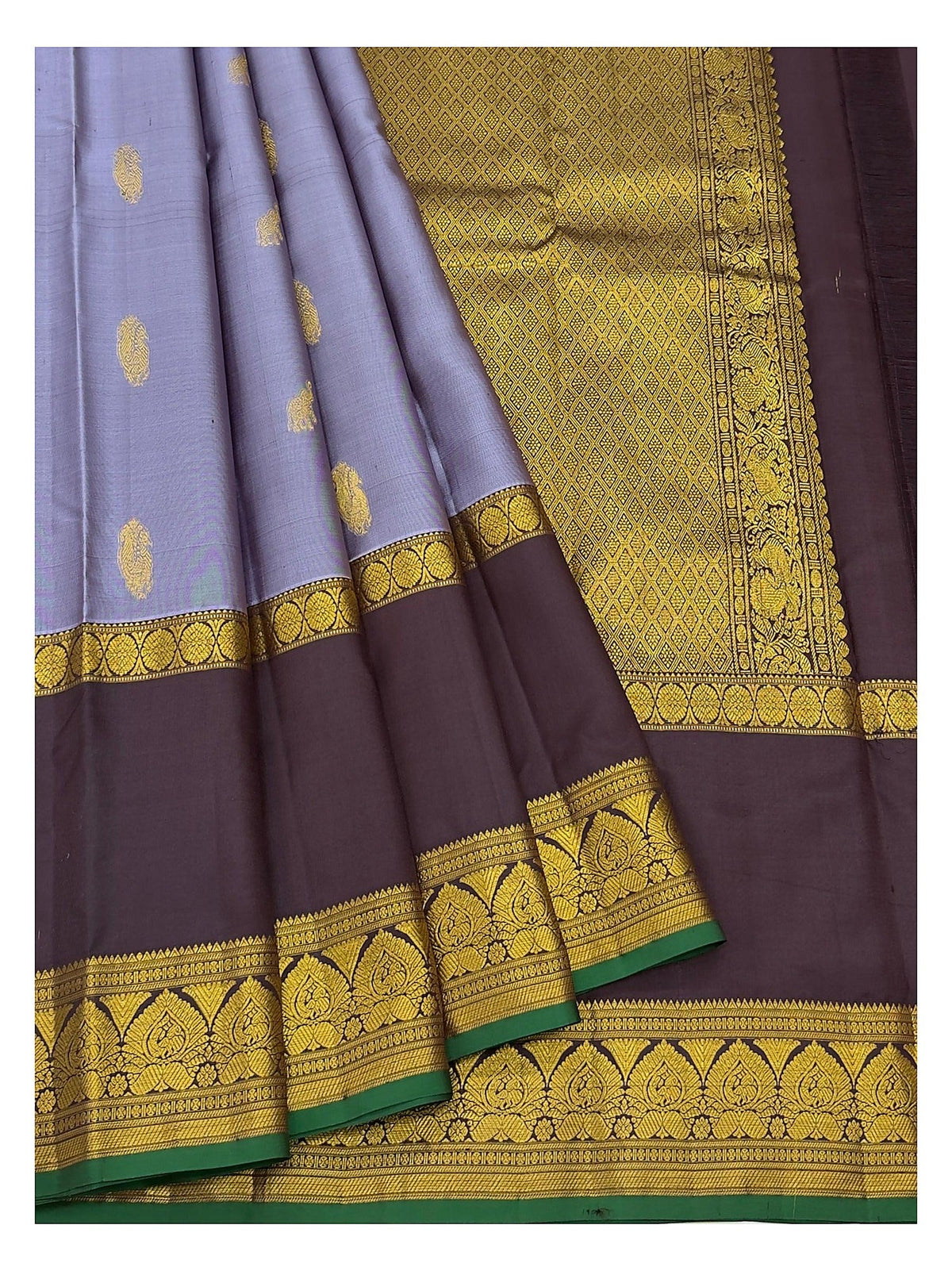 Draped view of lavender and deep plum Kanchipuram silk saree with patterned pallu and wide contrast border