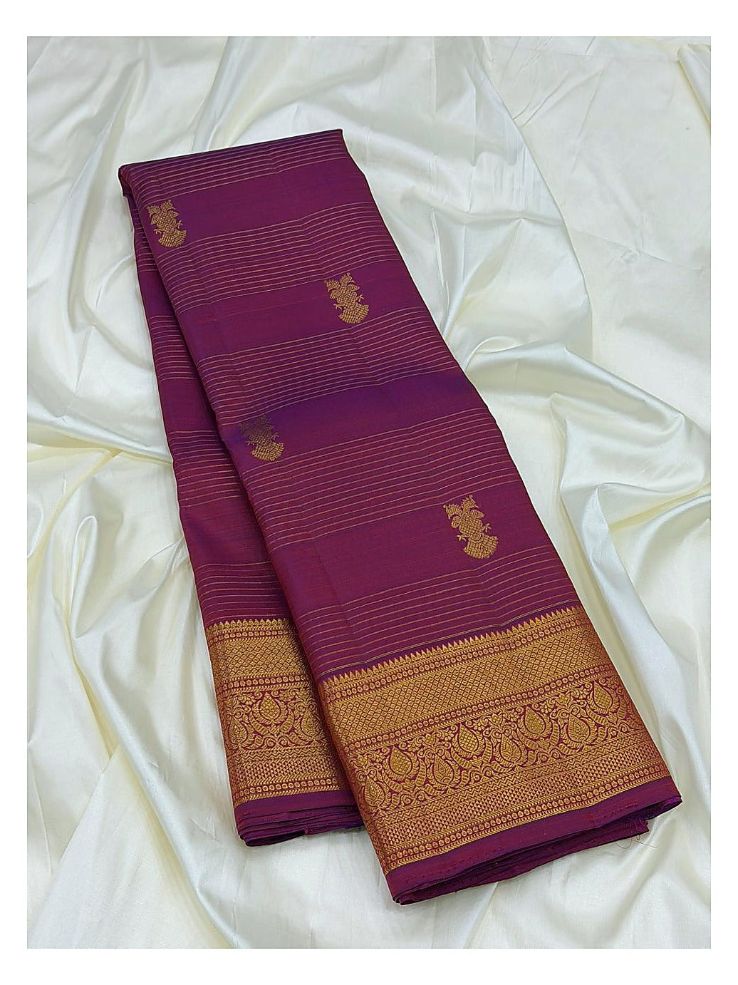 Magenta Handwoven Kanchipuram Silk Saree with Gold Butta Motifs and Broad Paisley Zari Border