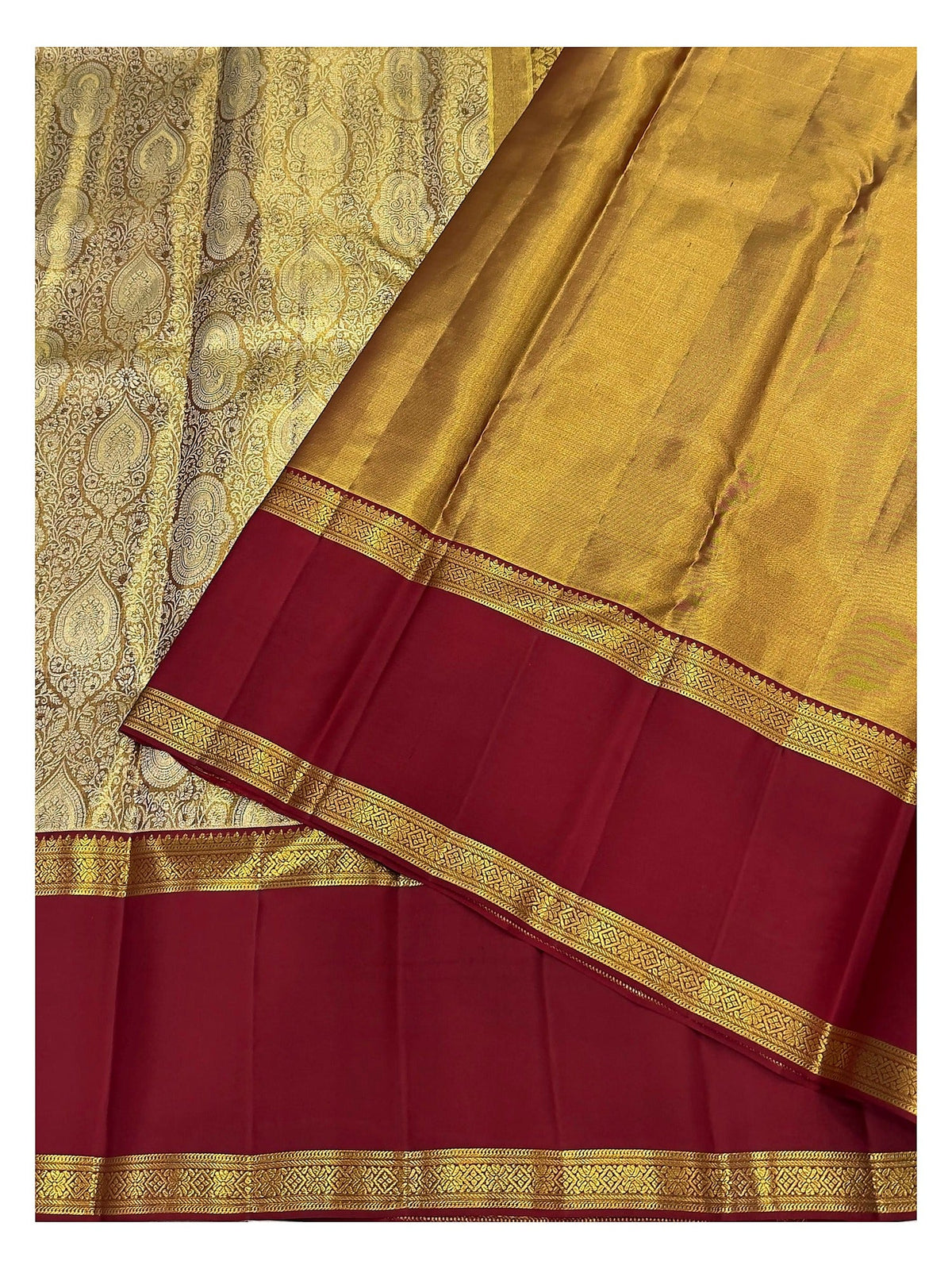 Close view of maroon border and gold-toned pallu on handwoven Kanchipuram silk saree