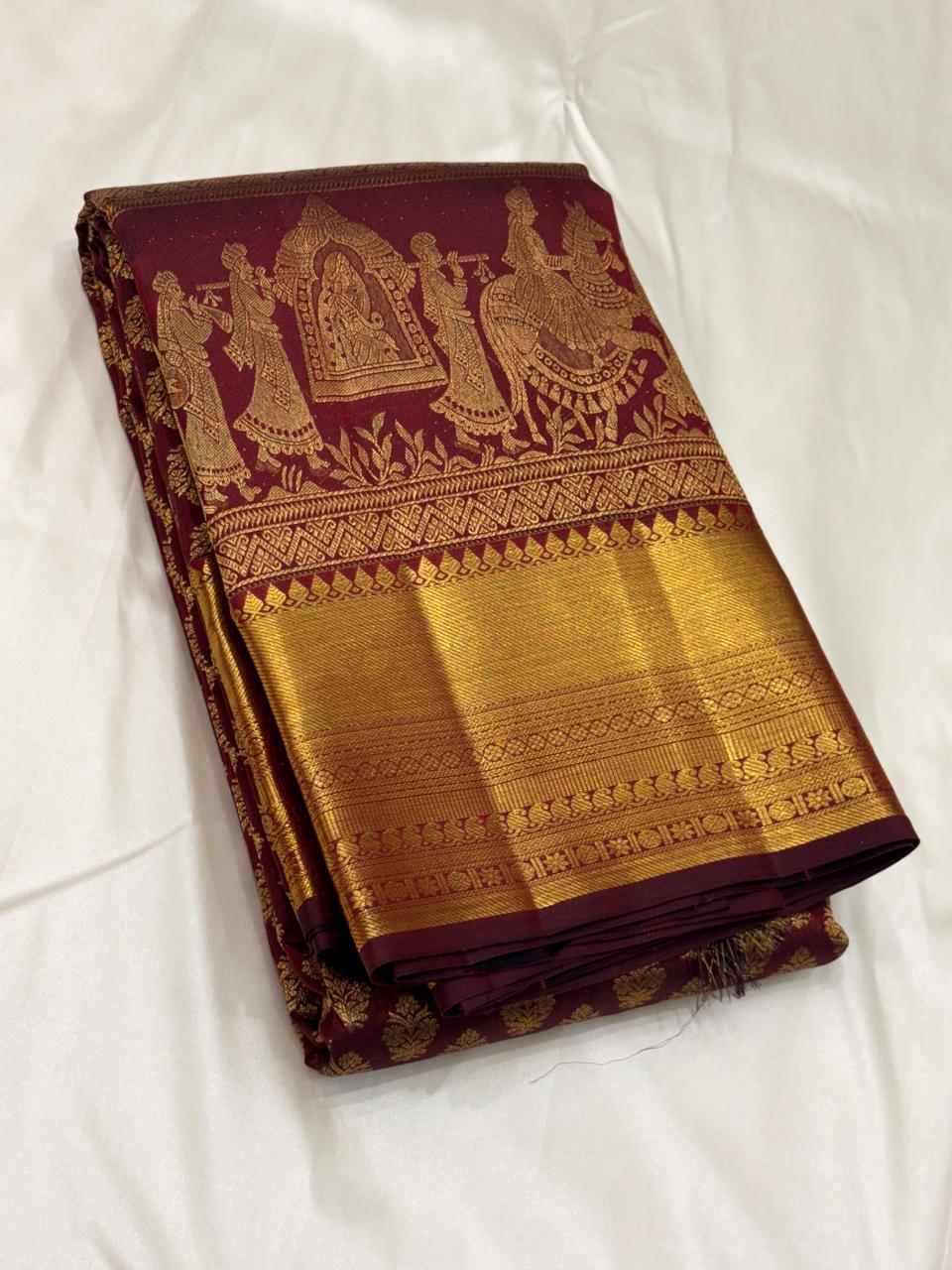 Handwoven pure silk saree with intricate gold zari motifs and rich pallu