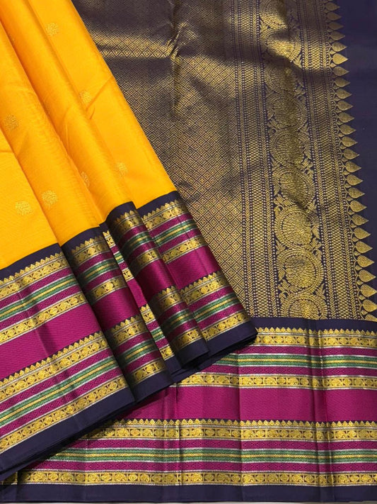 Mustard yellow Kanchipuram silk saree with purple zari border – full view