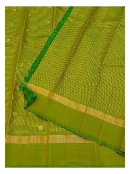 Green saree with fine gold checks, small butta motifs and folded woven border detail