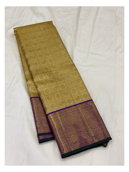 Full view of handwoven Kanchipuram silk saree with gold zari body and purple zari border