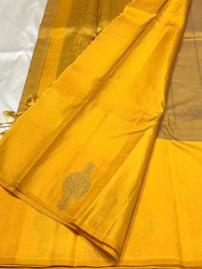 Handwoven pure silk saree with mustard yellow body and intricate zari motifs – close-up