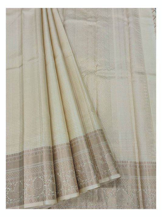Draped view of the soft gold beige pure silk saree with zari detailing