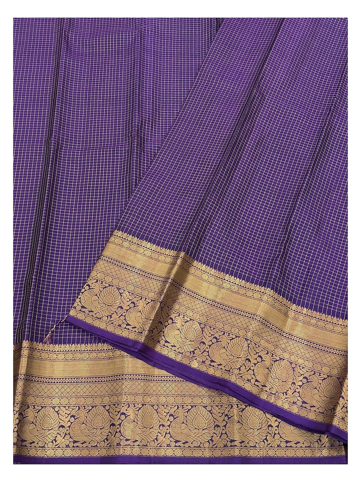 Close-up of the royal purple saree body and gold zari border
