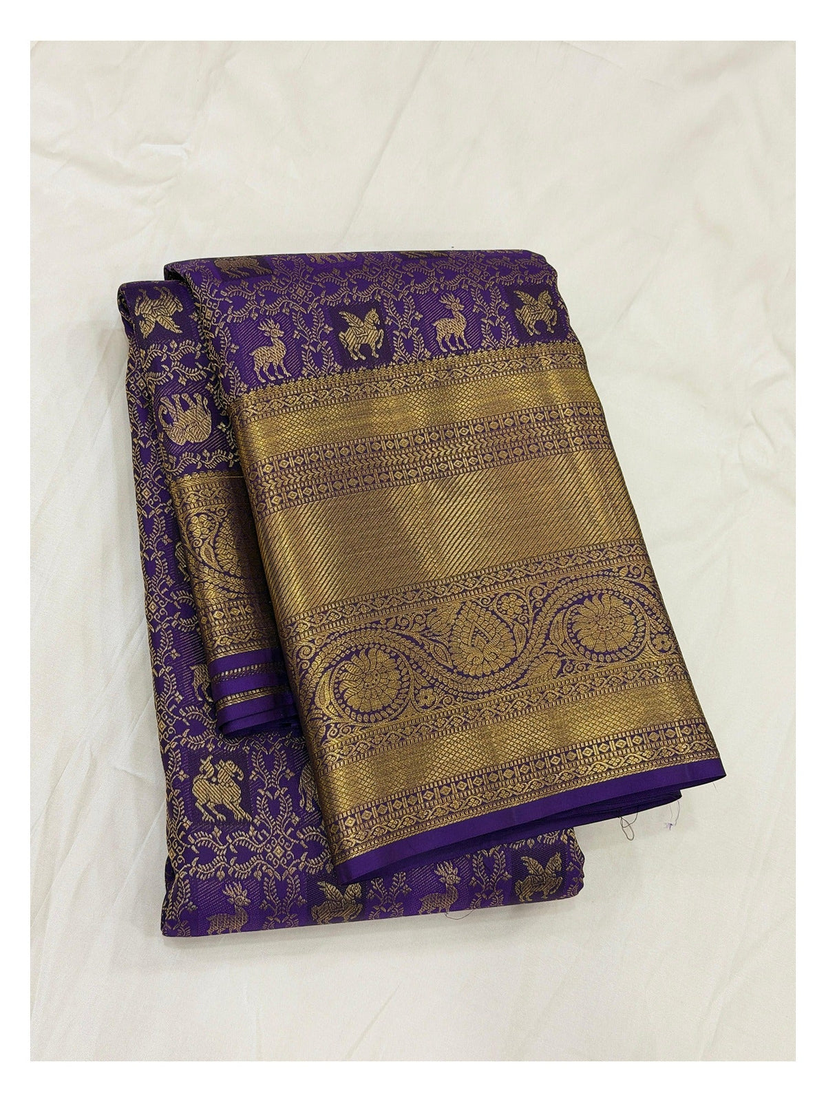 Royal Purple Handwoven Kanchipuram Silk Saree with Gold Woven Border and Animal Motifs front view