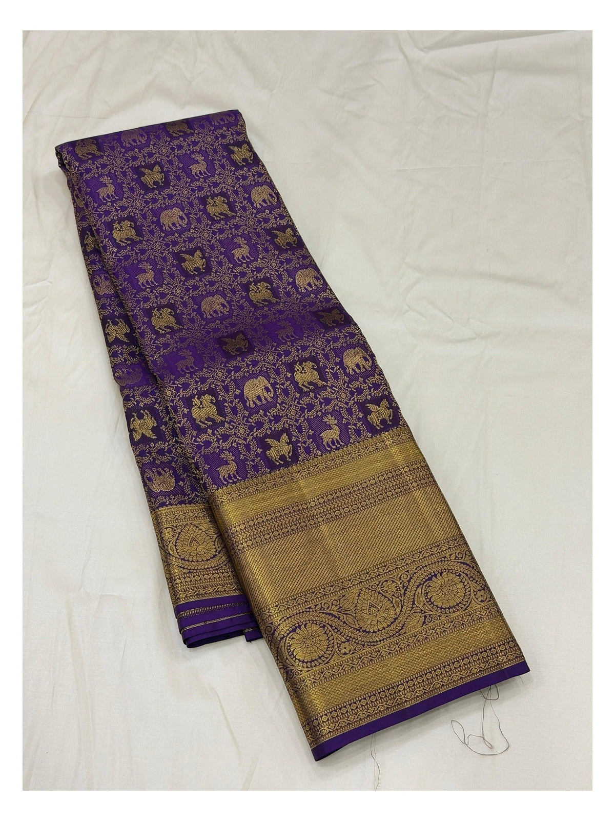 Royal Purple Handwoven Kanchipuram Silk Saree with Gold Woven Border and Animal Motifs