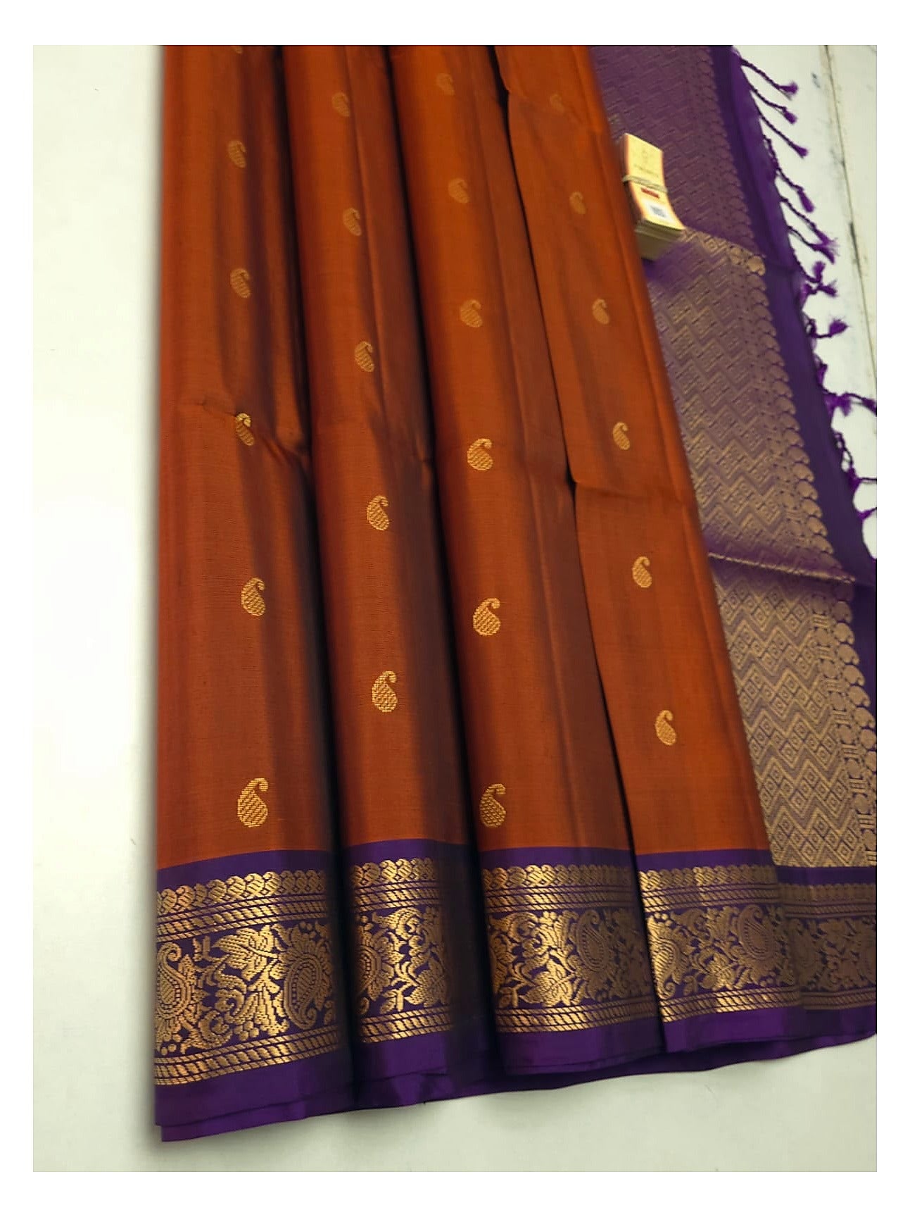 Rust orange handloom pure soft silk saree with purple border and mango buttas