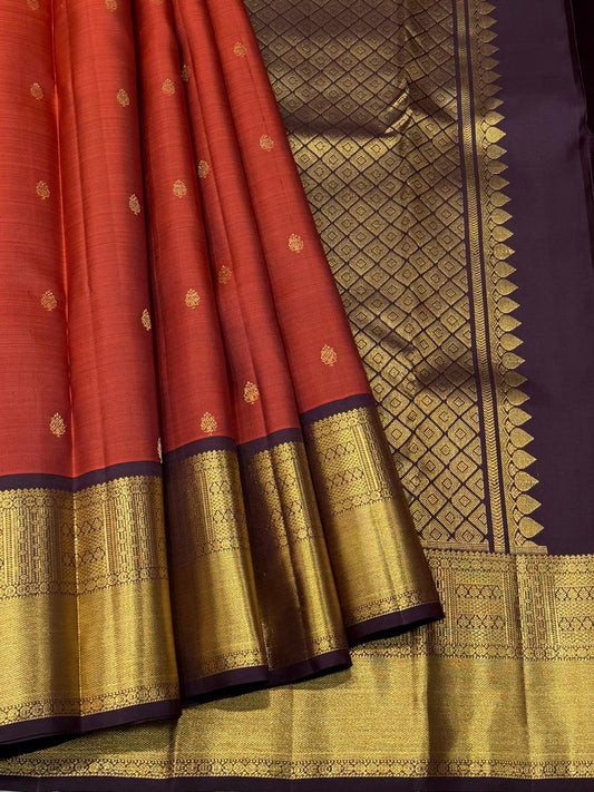Handwoven pure silk saree with gold buttas and temple zari motifs

